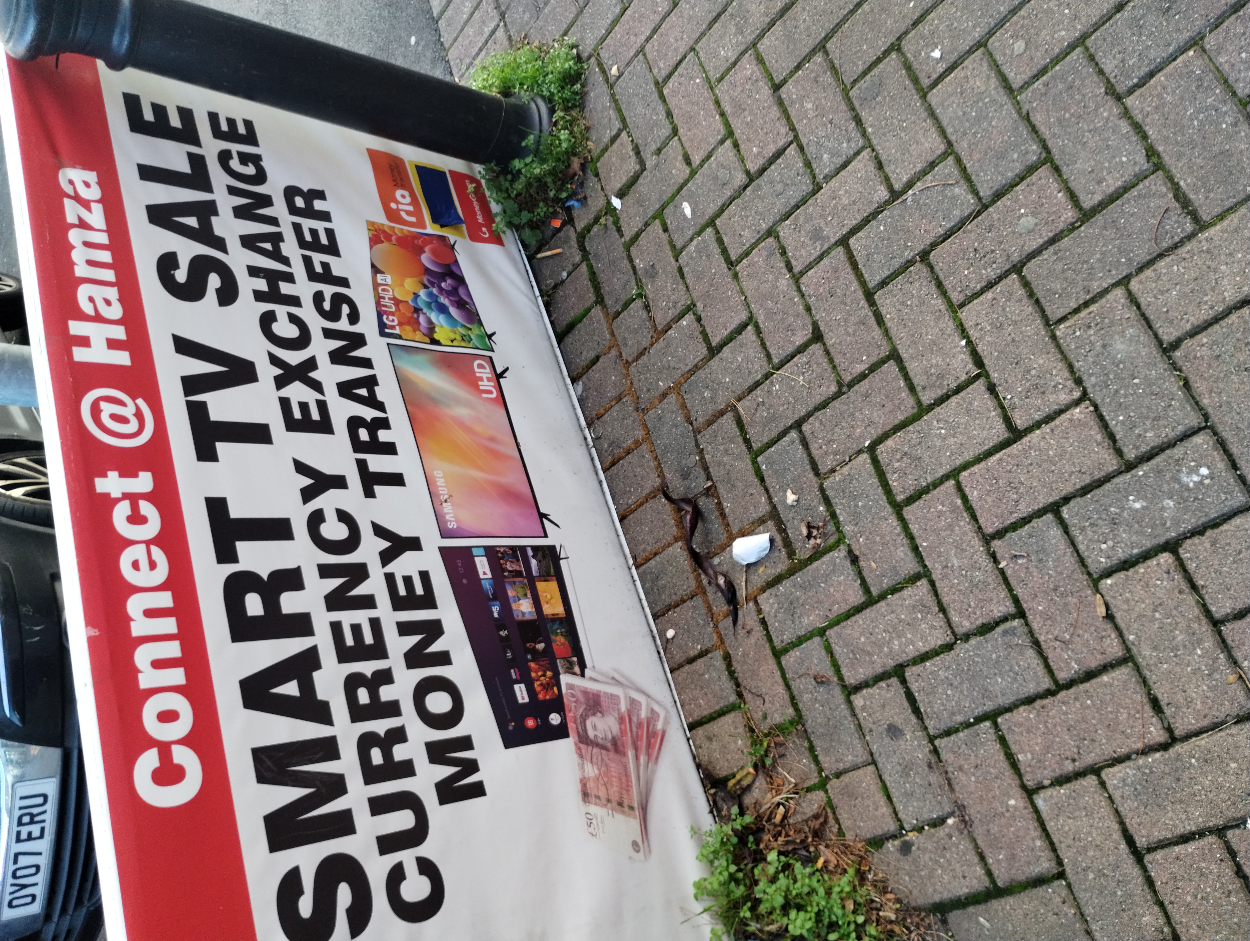 Banner outside Connect @ Hamza promoting currency exchange in Harehills.
