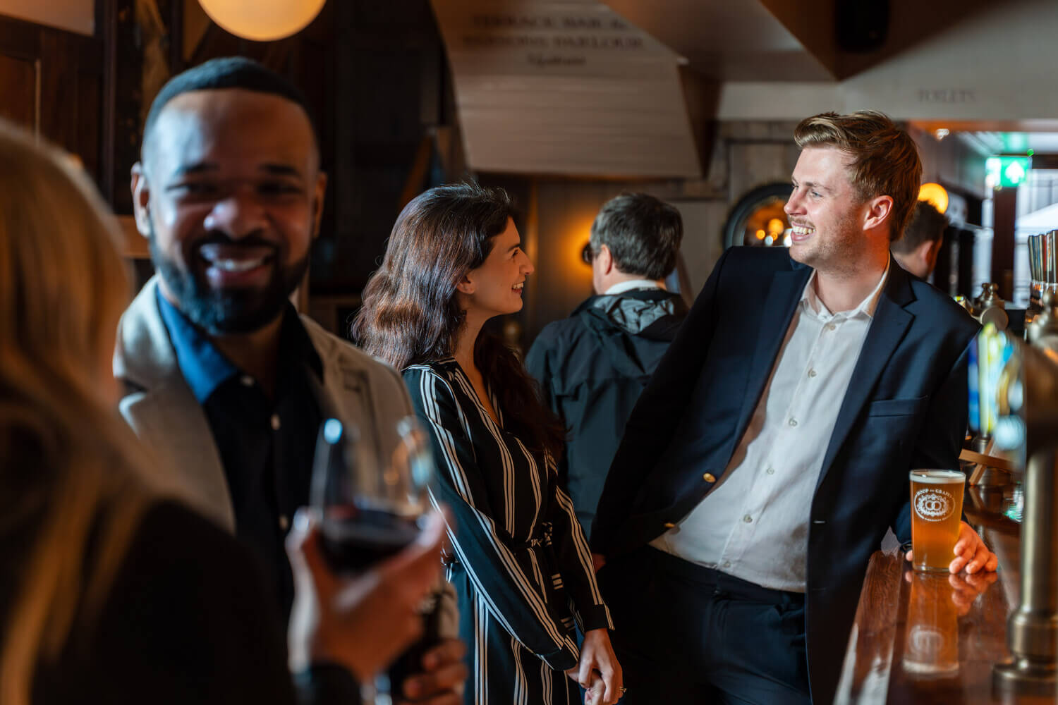 Group of people in Hoop & Grapes Shepherd Neame pub in Farringdon, London